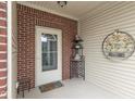 Welcoming front porch entrance of home, featuring a decorative welcome sign at 410 Angelina Way, Avon, IN 46123