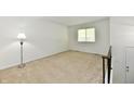 Bright bedroom featuring neutral carpet, a large window with blinds, and a built-in closet at 5225 Elderberry Rd, Noblesville, IN 46062
