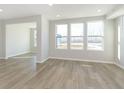 Spacious living room with large windows and hardwood floors, providing ample natural light at 9767 Behner Dr, Fishers, IN 46250