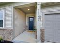 The front entrance features a modern black door, brick accents, and a welcoming mat at 1147 Kelsneland Dr, Avon, IN 46123