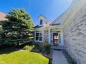 Close up of the home's front entrance, showcasing the door, windows, and brick facade at 12551 Hawks Landing Dr, Fishers, IN 46037