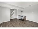 Spacious basement with gray walls, modern floors and staircase leading to the upper level at 12984 Shandon Ln, Fishers, IN 46038