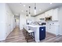 Modern kitchen featuring a large island, stainless steel appliances and ample storage at 13324 Roundtop Rd, Noblesville, IN 46060