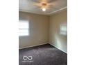 Standard bedroom with neutral walls, carpet, and two windows with blinds at 2202 E Brookside Ave, Indianapolis, IN 46218