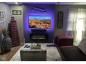 Stylish living room with modern fireplace, mounted television, and decorative accents at 2710 Fairview St, Anderson, IN 46011