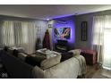 Inviting living room with cozy sectional, fireplace, and modern entertainment center at 2710 Fairview St, Anderson, IN 46011