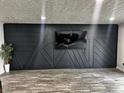 Living room showcasing stylish black accent wall with modern design elements and neutral flooring at 3401 W Kessler Blvd N Dr, Indianapolis, IN 46222