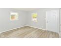 Bright living room with new floors, fresh paint, and natural light at 4013 Priscilla Ave, Indianapolis, IN 46226