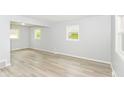 Bright and spacious living room featuring modern, light-colored flooring at 4013 Priscilla Ave, Indianapolis, IN 46226