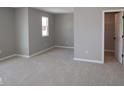 Neutral bedroom featuring plush carpeting, a window, and a walk-in closet for ample storage at 4075 Persian St, Greenwood, IN 46143