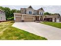 Charming two-story home with a three-car garage and spacious driveway at 4075 Persian St, Greenwood, IN 46143
