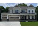 Charming two-story home with a three-car garage, covered porch, and manicured lawn in a picturesque setting at 4075 Persian St, Greenwood, IN 46143