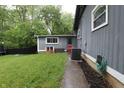 Cozy backyard with green grass and adjacent storage shed at 4644 N Ritter Ave, Indianapolis, IN 46226