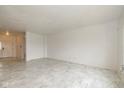 Bright and airy living area with neutral walls, marble flooring, and ample space for furniture at 4752 Chip Shot Ln, Indianapolis, IN 46235