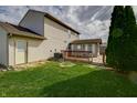 Backyard featuring a wooden deck and a sunroom addition to the home at 5351 Eel River Ct, Indianapolis, IN 46221