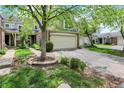 Charming two-story home featuring a two-car garage and beautifully landscaped front yard at 6505 Miramar Ct, Indianapolis, IN 46250