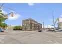 Street-level exterior view of the building showcasing its classic brick facade at 108 E Saint Clair St # E, Indianapolis, IN 46204