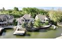 Waterfront home with a private dock and boat lift on a tree-lined lot at 14035 Stone Key Way, Fishers, IN 46037