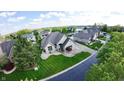 Charming brick home with a well-manicured lawn and mature trees in a desirable neighborhood at 14035 Stone Key Way, Fishers, IN 46037