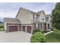 Beautiful home featuring a three-car garage, stone accents, and well-maintained landscaping at 1476 Anon Ct, Greenwood, IN 46143