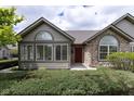 Inviting home with stone and siding accents, complemented by well-maintained front yard landscaping at 16628 Brownstone Ct, Westfield, IN 46074