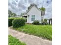 Traditional-style home with vinyl siding, green lawn, and mature landscaping, offering great curb appeal at 1806 Union St, Columbus, IN 47201