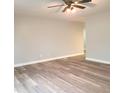 Spacious living room with wood flooring, neutral paint, and ample natural light at 3453 Payton Ave, Indianapolis, IN 46226