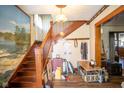 Foyer featuring a wooden staircase and decorative details at 4429 Iowa St, Clayton, IN 46118
