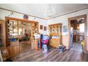Spacious living room with hardwood floors, chandelier, and an open layout at 4429 Iowa St, Clayton, IN 46118
