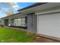 A gray home featuring an attached one car garage at 4720 E 42Nd St, Indianapolis, IN 46226