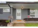 Cozy front porch with brickwork and a welcoming entrance at 4720 E 42Nd St, Indianapolis, IN 46226