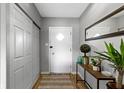 Inviting hallway with a closet, decorative rug and side table at 4720 E 42Nd St, Indianapolis, IN 46226