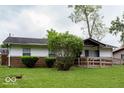 Quaint single-story house featuring a brick foundation and a large, grassy front lawn at 5605 Glencoe St, Indianapolis, IN 46226