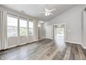 Spacious living room with hardwood floors, large windows, and open floor plan at 6816 Park Square Dr # C, Avon, IN 46123