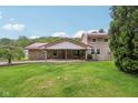 Traditional two-story home with stone and siding exterior, red roof, covered porch and mature landscaping at 775 Baker Rd, Martinsville, IN 46151