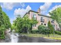 Corner lot featuring flowering landscape with mature trees offering a peaceful setting at 952 Junction Pl, Indianapolis, IN 46220
