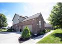 View of the exterior with three car garage and beautiful landscaping at 10267 Ranford Blvd, Fishers, IN 46040