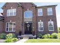 Close up on the front entrance with flower decorated wreath at 10267 Ranford Blvd, Fishers, IN 46040