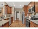 Well-equipped kitchen features stainless steel appliances and granite countertops at 1401 Blackthorne N Trl, Plainfield, IN 46168