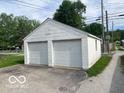 Two car detached garage is constructed from white cinderblock and includes two access doors at 1440 E Morgan E St, Martinsville, IN 46151