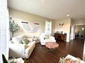 Cozy living room with plush seating, stylish decor, and ample natural light creating a warm and inviting space at 1454 Woodfield Dr, Greenwood, IN 46143