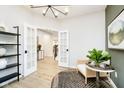 Inviting office space featuring French doors, a cozy seating area, and modern decor at 3873 Goodwin Dr, Zionsville, IN 46077