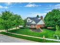 Well-situated home with a lush green lawn and mature trees at 3996 Brockton Manor N Dr, Greenwood, IN 46143