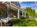 Inviting covered front porch with seating and landscaped yard at 413 E 40Th St, Indianapolis, IN 46205