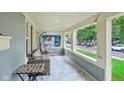 Inviting covered front porch with comfortable seating and string lights at 4245 Guilford Ave, Indianapolis, IN 46205