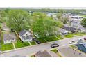 Residential neighborhood featuring cozy homes with green trees and a street with several parked vehicles at 425 S Oakland Ave, Indianapolis, IN 46201