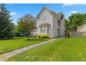 Beautifully landscaped front yard showcasing a well-maintained lawn and stone pathway at 608 East 21St St, Indianapolis, IN 46202