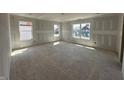 Spacious bedroom featuring ample natural light from multiple windows, ready for your personal touch and customization at 6306 Countryside Forge Way, Indianapolis, IN 46259