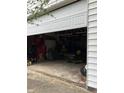 Spacious attached garage with ample storage space, perfect for vehicles and hobby equipment at 6430 E Stop 11 Rd, Indianapolis, IN 46237