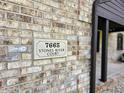 Close up of 7665 Stones River Court address sign mounted on brick wall at 7665 Stones River Ct, Indianapolis, IN 46259
